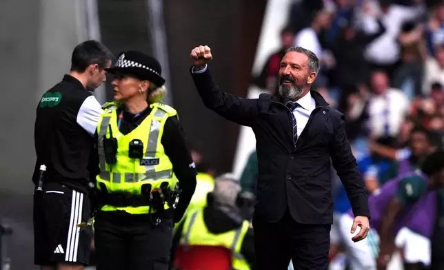 Rangers manager Derek McInnes celebrates their side's first goal during the Scottish League Cup soccer match between Rangers and Celtic, in Glasgow, Sunday Sept. 13, 2026. (Andrew Milligan/PA via AP)