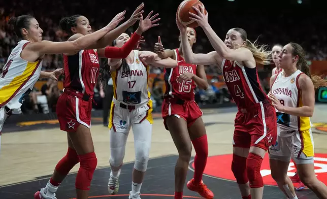 Paige Bueckers, of the United States, gets a rebound during the Women's Basketball World Cup semifinal match between the United States and Spain in Berlin, Saturday, Sept. 12, 2026. (AP Photo/Ebrahim Noroozi)