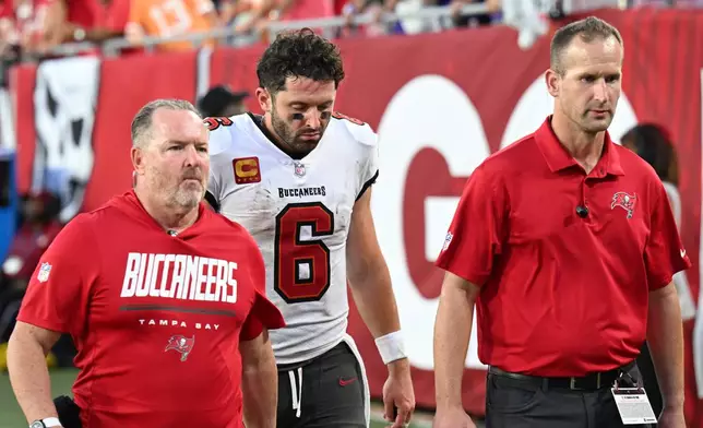 Tampa Bay Buccaneers quarterback Baker Mayfield (6) leaves the field during the second half of an NFL football game against the Minnesota Vikings in Tampa, Fla., Sunday, Sept. 27, 2026. (AP Photo/Jason Behnken)