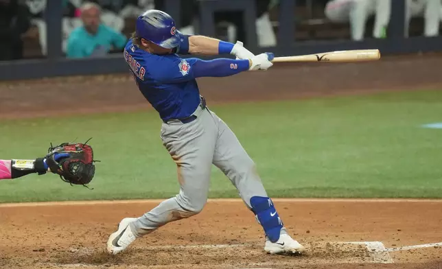 Chicago Cubs' Nico Hoerner (2) hits a single to left field during the sixth inning of a baseball game against the Miami Marlins Friday, Sept. 4, 2026, in Miami. (AP Photo/Marta Lavandier)