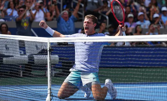 Neal Skupski, of Britain, celebrates with Christian Harrison, of the United States, after winning the men's doubles final of the U.S. Open tennis championships Kevin Krawietz, of Germany, and Tim Puetz, of Germany, Saturday, Sept. 12, 2026, in New York. (AP Photo/Kirsty Wigglesworth)