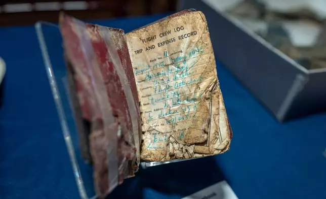 A log book recovered from the wreckage of United Airlines Flight 93 in Shanksville, Pa., is put on temporary display at the Smithsonian's National Museum of American History in Washington, Thursday, Sept. 10, 2026. (AP Photo/J. Scott Applewhite)