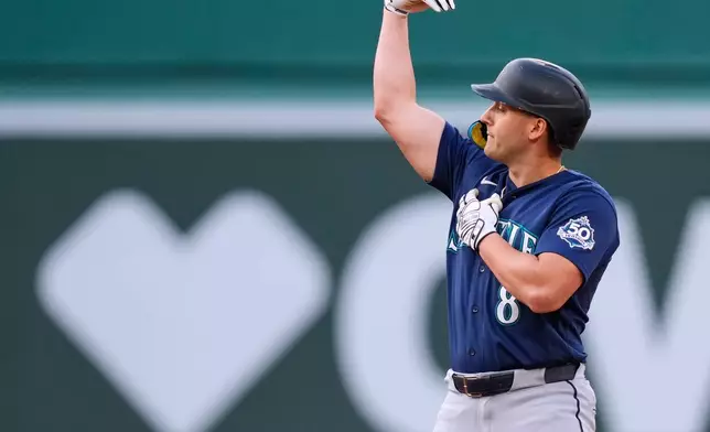Seattle Mariners' Dominic Canzone celebrates after his RBI double during the sixth inning of a baseball game against the Boston Red Sox, Wednesday, Sept. 2, 2026, in Boston. (AP Photo/Charles Krupa)