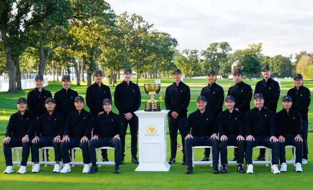 International players pose for a team portrait prior to the start of the Presidents Cup golf tournament against the USA team at Medinah Country Club, Wednesday, Sept. 23, 2026, in Medinah, Ill. (AP Photo/Matt Slocum)