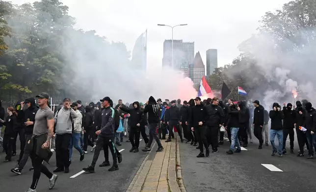 Protesters attend a far-right groups' protest against immigration and asylum policies, in The Hague, Netherlands, Saturday, Sept. 19, 2026. (AP Photo/Mouneb Taim)