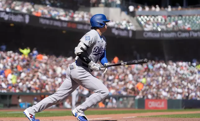 Los Angeles Dodgers designated hitter Shohei Ohtani hits a single during the fifth inning of a baseball game against the San Francisco Giants, Saturday, Sept. 26, 2026, in San Francisco. (AP Photo/Jeff Chiu)