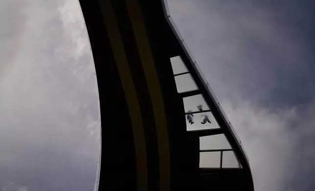 People walk along the Glass bridge in downtown Kyiv, Ukraine, Saturday, Sept. 5, 2026. (AP Photo/Francisco Seco)