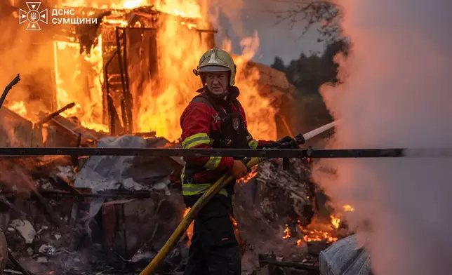 In this photo provided by the Ukrainian Emergency Service, firefighters put out a fire at private homes following a Russian air attack in Sumy, Ukraine, Wednesday, Sept. 16, 2026. (Ukrainian Emergency Service via AP)