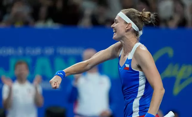 Marie Bouzkova of Czech Republic celebrates after defeating Sonay Kartal of Britain in a quarterfinal match for the Billie Jean King Cup held in Shenzhen in southern China's Guangdong province, Tuesday, Sept. 22, 206. (AP Photo/Andy Wong)