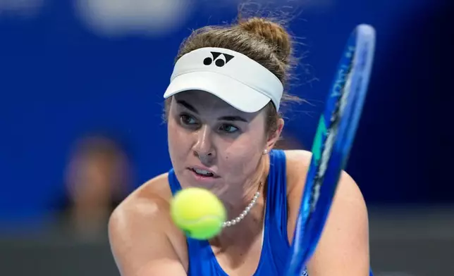 Linda Noskova of Czech Republic returns the ball to Katie Boulter of Britain in a quarterfinal match for the Billie Jean King Cup held in Shenzhen in southern China's Guangdong province, Tuesday, Sept. 22, 2026. (AP Photo/Andy Wong)