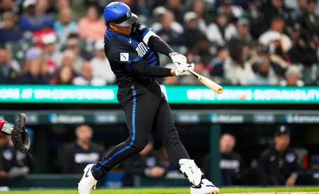 Detroit Tigers' Eduardo Valencia hits a double against the Washington Nationals during the third inning of a baseball game Monday, Sept. 21, 2026, in Detroit. (AP Photo/Paul Sancya)