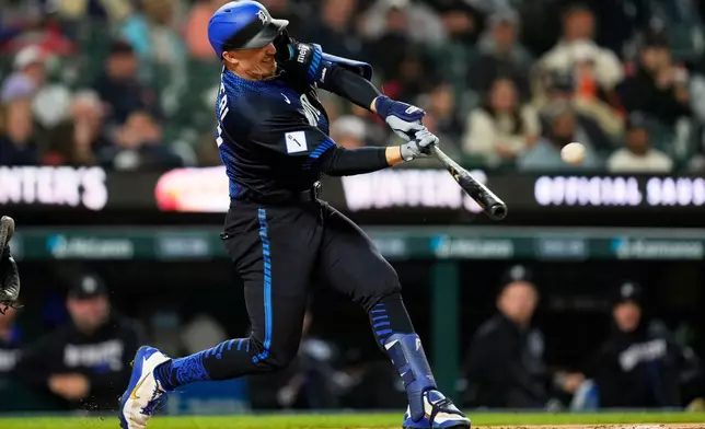 Detroit Tigers' Ben Malgeri hits a three-run home run against the Washington Nationals during the fifth inning of a baseball game Monday, Sept. 21, 2026, in Detroit. (AP Photo/Paul Sancya)