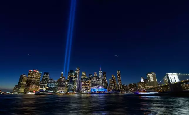 The Tribute in Light shines over lower Manhattan, Friday, Sept. 11, 2026 in the Brooklyn Borough of New York. (AP Photo/Adam Gray)