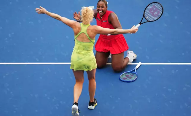 Katerina Siniakova, of the Czech Republic, left, and Taylor Townsend, of the United States, celebrate winning the women's doubles final of the U.S. Open tennis championships against Ashlyn Krueger and Robin Montgomery, both of the United States, Friday, Sept. 11, 2026, in New York. (AP Photo/Kirsty Wigglesworth)