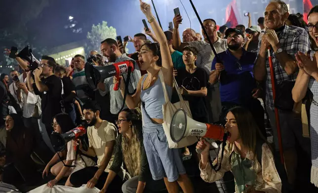 Protesters take part in a rally in Tirana, Albania, Saturday, Sept. 12, 2026, against plans for the construction of a luxury resort in a protected coastal area, linked to Jared Kushner, U.S. President Donald Trump's son-in-law. (AP Photo/Hameraldi Agolli)