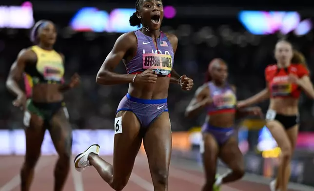 Melissa Jefferson-Wooden, of the United States, reacts after winning the women's 200 meters final during the World Athletics Ultimate Championship in Budapest, Hungary, Sunday, Sept. 13, 2026. (AP Photo/Denes Erdos)