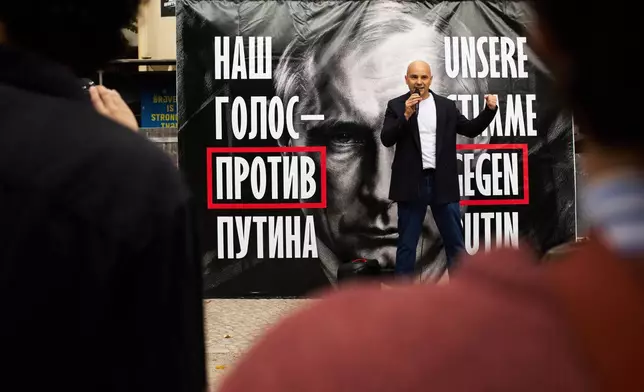 Russian political activist Andrei Pivovarov speaks during a protest in front of Russian embassy as people cast their vote for the Russian parliament election in Berlin, Germany, Sunday, Sept. 20, 2026. (AP Photo/Markus Schreiber)