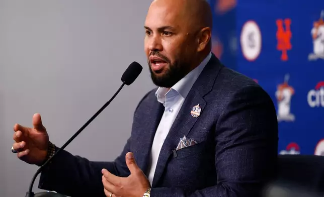 Carlos Beltran answers questions from reporters during press conference, Saturday, Sept. 19, 2026, in New York. (AP Photo/Noah K. Murray)