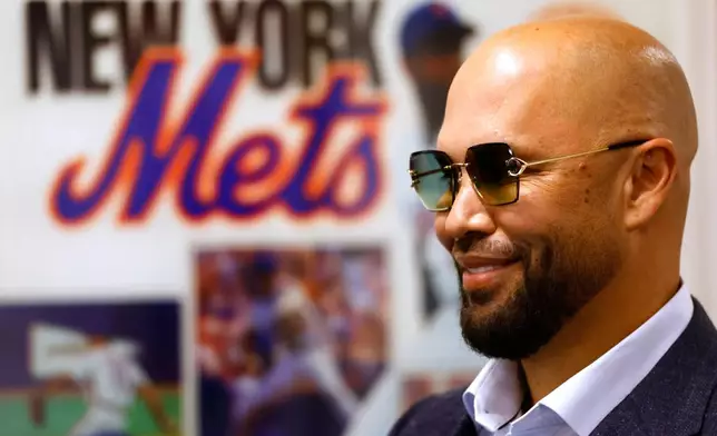 Carlos Beltran answers questions from reporters during press conference, Saturday, Sept. 19, 2026, in New York. (AP Photo/Noah K. Murray)