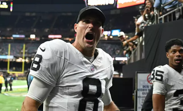 Las Vegas Raiders quarterback Kirk Cousins (8) celebrates the team's win in an NFL football game against the New Orleans Saints in New Orleans, Sunday, Sept. 27, 2026. (AP Photo/Gerald Herbert)
