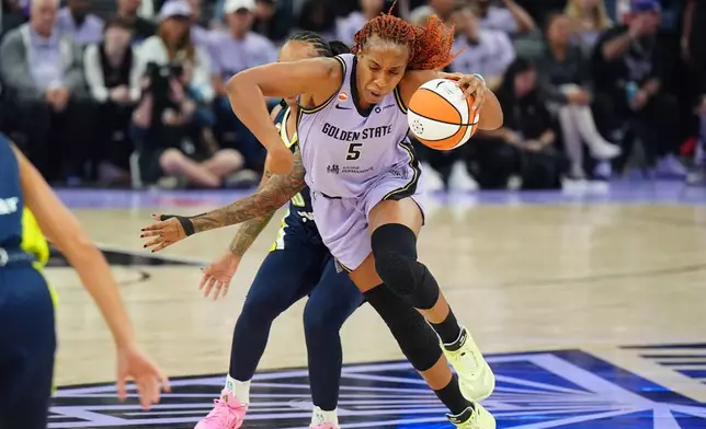 Golden State Valkyries forward Kayla Thornton (5) drives to the basket during the first half of a WNBA basketball first-round playoff game against the Dallas Wings Sunday, Sept. 27, 2026, in San Francisco. (AP Photo/Alan Greth)