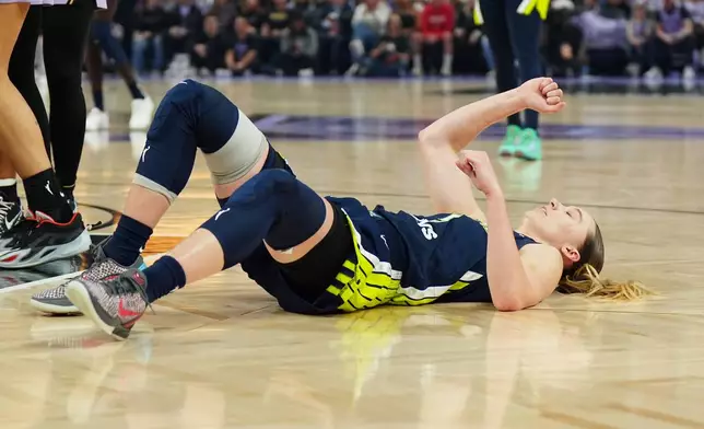 Dallas Wings guard Paige Bueckers reacts on the court after being fouled in the first half of a WNBA basketball first-round playoff game against the Golden State Valkyries Sunday, Sept. 27, 2026, in San Francisco. (AP Photo/Alan Greth)