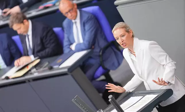 Federal chairwoman and parliamentary group leader of the AfD Alice Weidel opens the general debate as part of the budget deliberations in the Bundestag, with German Chancellor Friedrich Merz sitting on the background, in Berlin, Wednesday Sept. 9, 2026 (Michael Kappeler/dpa via AP)