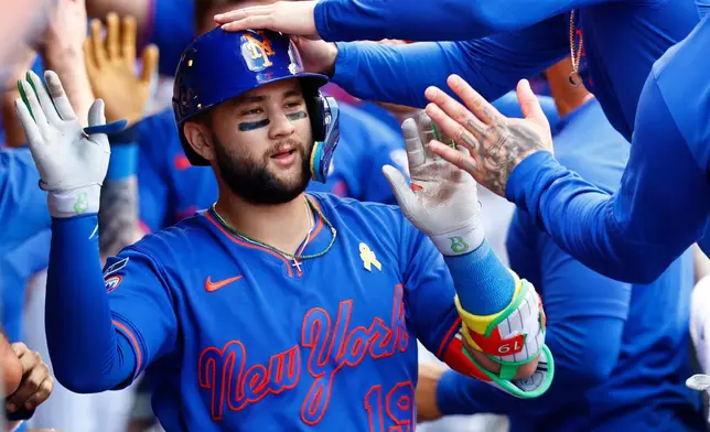 New York Mets' Bo Bichette celebrates with teammates after hitting a three-run home run against the San Francisco Giants during the eighth inning of a baseball game, Sunday, Sept. 6, 2026, in New York. (AP Photo/Noah K. Murray)