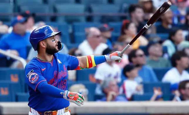 New York Mets' Bo Bichette follows through on a three-run home run against the San Francisco Giants during the eighth inning of a baseball game, Sunday, Sept. 6, 2026, in New York. (AP Photo/Noah K. Murray)