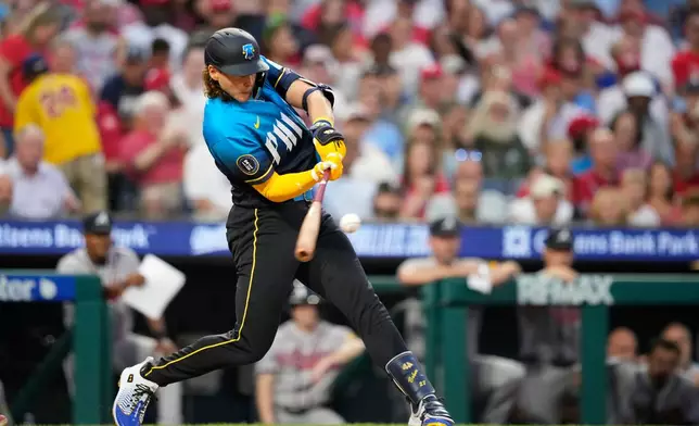 Philadelphia Phillies' Alec Bohm hits a run-scoring double against Atlanta Braves pitcher Chris Sale during the second inning of a baseball game Friday, Sept. 4, 2026, in Philadelphia. (AP Photo/Matt Slocum)