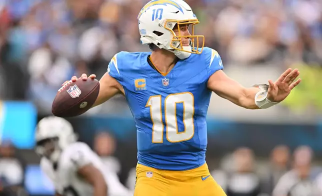 Los Angeles Chargers quarterback Justin Herbert (10) throws a pass during the first half during an NFL football game against the Las Vegas Raiders in Inglewood, Calif., Sunday, Sept. 20, 2026. (AP Photo/Katie Chin)