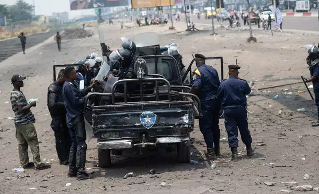 Security forces take position ahead of a protest organized by opposition parties against constitutional changes proposed by President Felix Tshisekedi, in Kinshasa, Congo, Tuesday, Sept. 15, 2026. (AP Photo/Samy Ntumba Shambuyi)