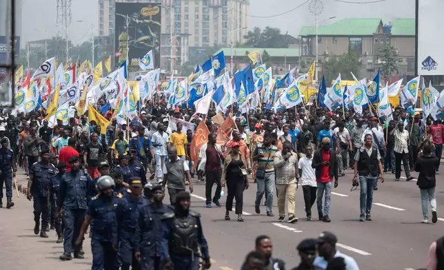 People march during a protest organized by opposition parties against constitutional changes proposed by President Felix Tshisekedi, in Kinshasa, Congo, Tuesday, Sept. 15, 2026. (AP Photo/Samy Ntumba Shambuyi)