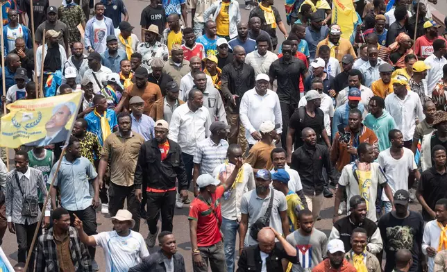 People march during a protest organized by opposition parties against constitutional changes proposed by President Felix Tshisekedi, in Kinshasa, Congo, Tuesday, Sept. 15, 2026. (AP Photo/Samy Ntumba Shambuyi)
