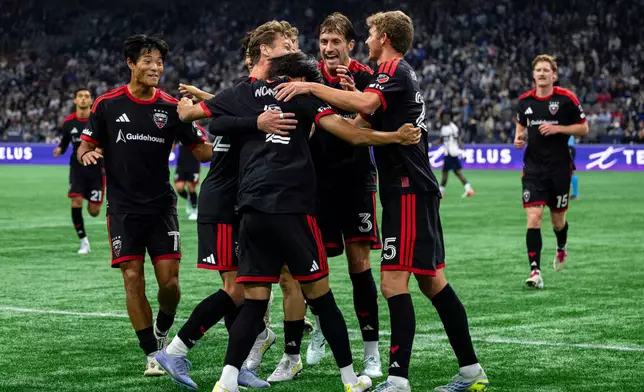 D.C. United's Kimito Nono (2) celebrates with teammates after scoring against the Vancouver Whitecaps during the first half of an MLS soccer match in Vancouver, British Columbia, Saturday, Sept. 26, 2026. (Jacob Mallari/The Canadian Press via AP)