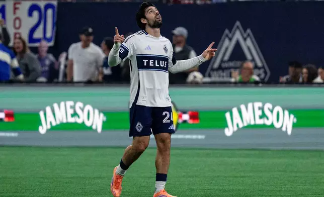 Vancouver Whitecaps' Brian White (24) celebrates after scoring against DC United during the first half of an MLS soccer match in Vancouver, British Columbia, Saturday, Sept. 26, 2026. (Jacob Mallari/The Canadian Press via AP)