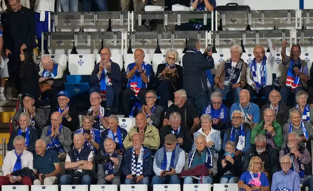 Como older fans sit on the tribune prior to the start of the Champions League opening phase soccer match between Como and Leipzig in Como, Italy, Thursday, Sept. 10, 2026, Como officials giving up seats to older fans. (AP Photo/Luca Bruno)