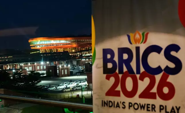 An illuminated Bharat Mandapam, the main venue of the BRICS summit is seen in New Delhi, India, Saturday, Sept. 12, 2026. (AP Photo/Mukhtar Khan)