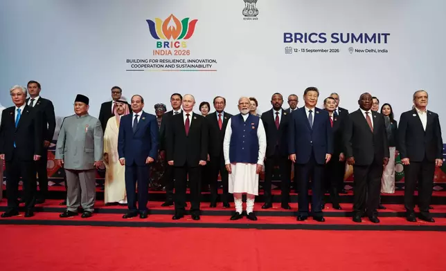 Participants of the BRICS Plus Outreach format pose for a photo in New Delhi, India, on Sunday, Sept. 13, 2026. (Alexander Kazakov, Sputnik, Kremlin Pool Photo via AP)
