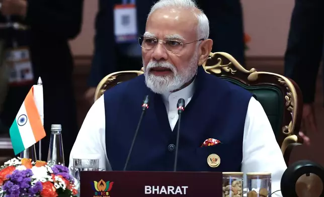Indian Prime Minister Narendra Modi attends a session of the BRICS Plus Outreach format in New Delhi, India, on Sunday, Sept. 13, 2026. (Alexander Kazakov, Sputnik, Kremlin Pool Photo via AP)