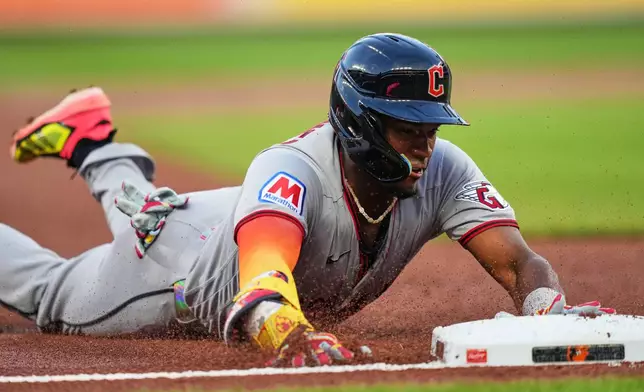 Cleveland Guardians' Angel Martínez slides into third base after hitting a triple during the second inning of a baseball game against the Baltimore Orioles, Tuesday, Sept. 8, 2026, in Baltimore. (AP Photo/Stephanie Scarbrough)