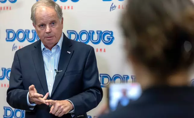 FILE - Doug Jones, Democratic nominee for Governor of Alabama, speaks to the media before a town hall hosted by Troy University College Democrats and the Pike County Democrats, Aug. 18, 2026, in Troy, Ala. (AP Photo/Vasha Hunt, File)