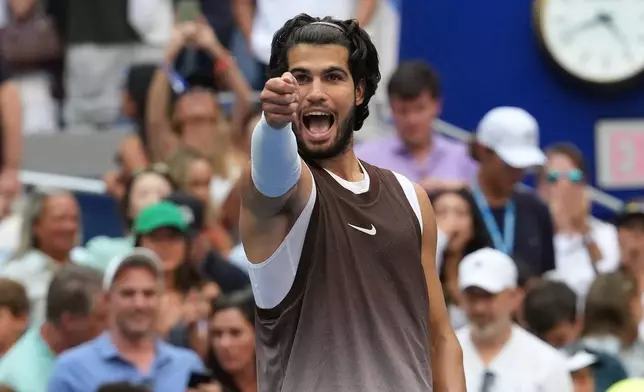 Carlos Alcaraz, of Spain, gestures after he won his match against Wu Yibing, of China, during the third round of the U.S. Open tennis championships Friday, Sept. 4, 2026, in New York. (AP Photo/Kirsty Wigglesworth)