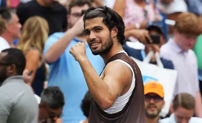 Carlos Alcaraz, of Spain, gestures after he won his match against Wu Yibing, of China, during the third round of the U.S. Open tennis championships Friday, Sept. 4, 2026, in New York. (AP Photo/Kirsty Wigglesworth)