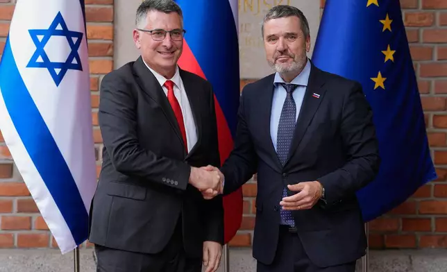Israel's Foreign Minister Gideon Sa'ar, left, is welcomed by his Slovenian counterpart Tone Kajzer in Ljubljana, Slovenia, Wednesday, Sept. 9, 2026. (AP Photo/Darko Bandic)