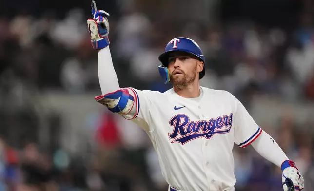 Texas Rangers' Brandon Nimmo celebrates his single in the second inning of a baseball game Tuesday, Sept. 22, 2026, in Arlington, Texas. (AP Photo/Tony Gutierrez)