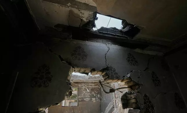 A hole in the ceiling and damaged walls are seen inside a home that Iranian media said was hit by a U.S. strike while a wedding celebration was taking place late Tuesday, Sept. 1, in Kuhestak, southern Iran, Friday, Sept. 4, 2026. (AP Photo/Vahid Salemi)