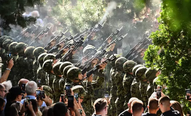 Serbian national military servicemen fire a three-volley salute during the funeral of former Bosnian Serb army commander Ratko Mladic, who died last week while serving a life sentence for genocide and other atrocities during the war in Bosnia, at the Topcider Cemetery, in Belgrade, Serbia, Monday, Sept. 7, 2026. (AP Photo)