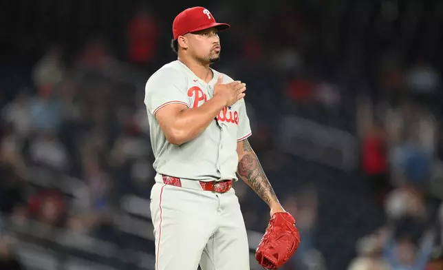 Philadelphia Phillies relief pitcher Jhoan Duran reacts at the end of a baseball game against the Washington Nationals, Wednesday, Sept. 16, 2026, in Washington. (AP Photo/Nick Wass)