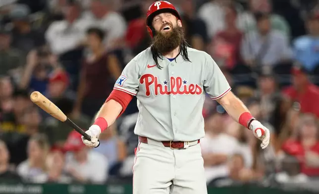 Philadelphia Phillies'Brandon Marsh reacts during his at bat during the fourth inning of a baseball game against the Washington Nationals Wednesday, Sept. 16, 2026, in Washington. (AP Photo/Nick Wass)